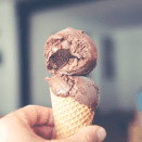 A man holds an ice cream in his hands
